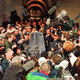 The Thimble (center) is mobbed by reporters following his April 5 testimony.